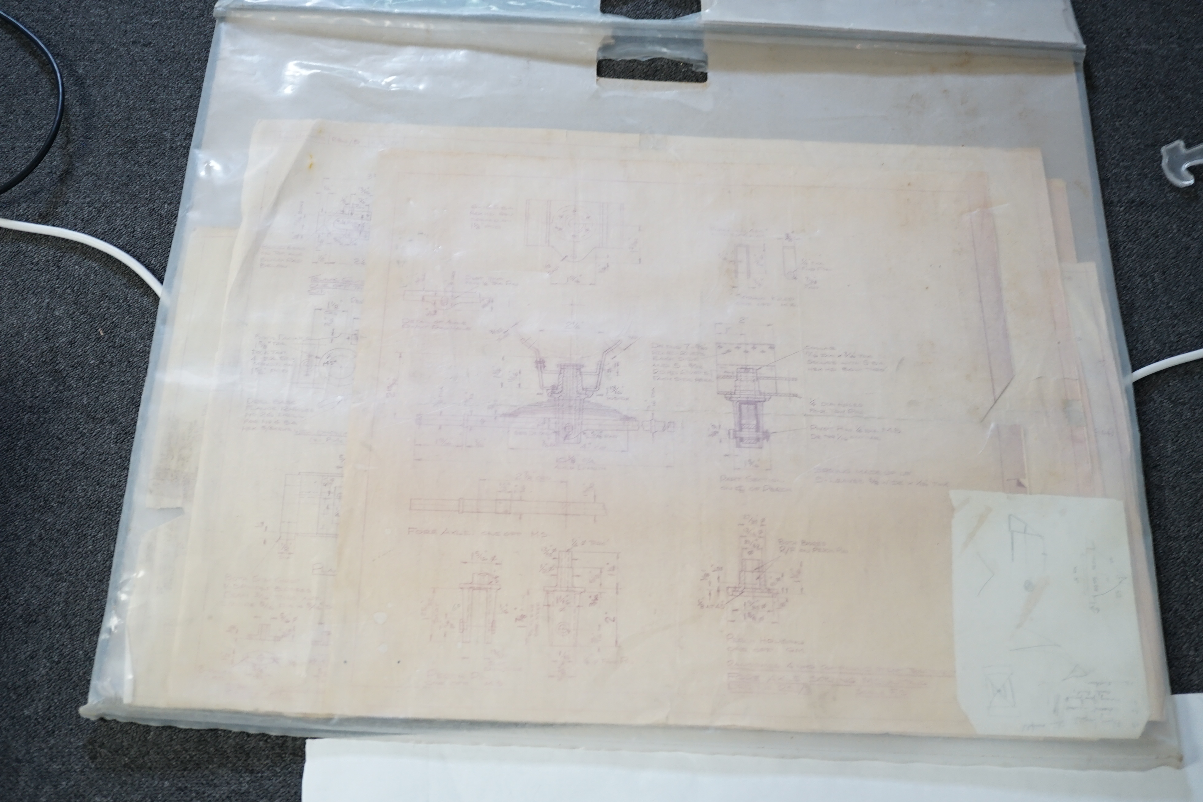 A partially constructed kit comprising of the major components of machined and cast parts to build a two inch scale live steam Ransomes 4 N.H.P. traction engine, including a set of drawings